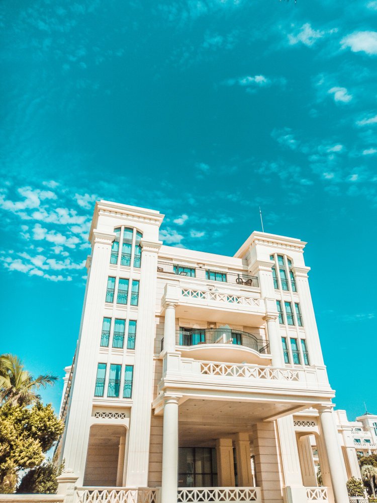 White concrete building with balconies